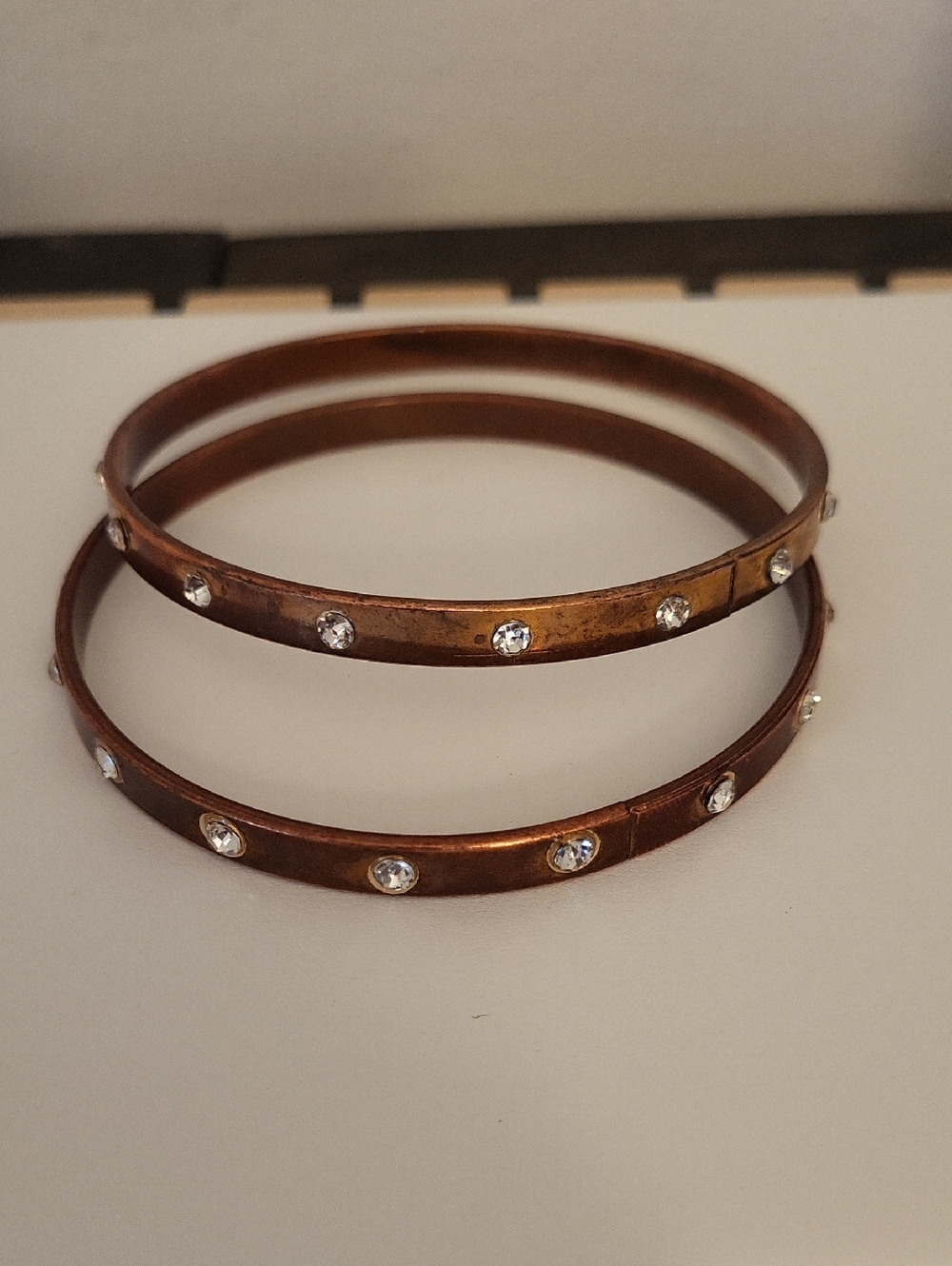 2 Rhinestone-Studded Copper Tone Bangle Bracelets